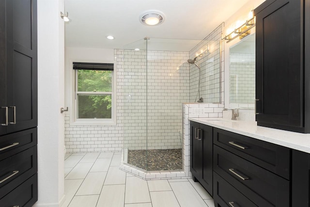 N2559 Pleasant View Ln, Waupaca, WI 54981 - bathroom featuring vanity, a stall shower, tile patterned flooring, and recessed lighting