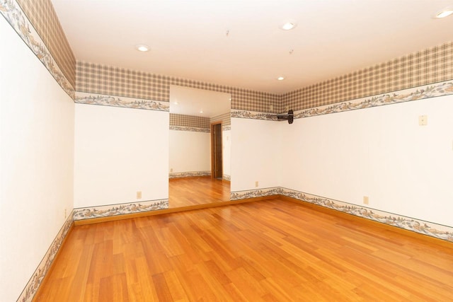 N2559 Pleasant View Ln, Waupaca, WI 54981 - spare room featuring wood finished floors, wallpapered walls, and recessed lighting