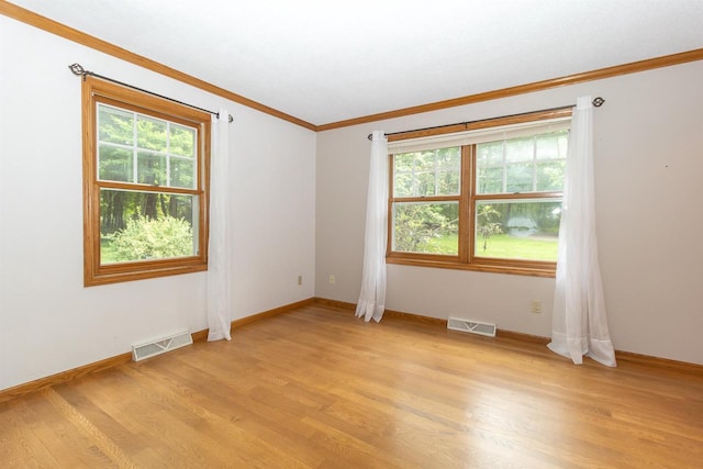N2559 Pleasant View Ln, Waupaca, WI 54981 - unfurnished room with crown molding and light wood-style flooring