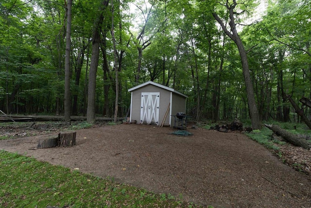 N2559 Pleasant View Ln, Waupaca, WI 54981 - view of yard featuring a storage unit and a view of trees