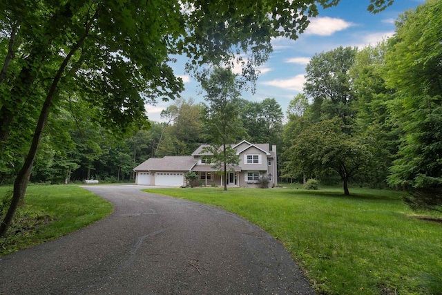 N2559 Pleasant View Ln, Waupaca, WI 54981 - view of front facade with an attached garage, driveway, and a front lawn