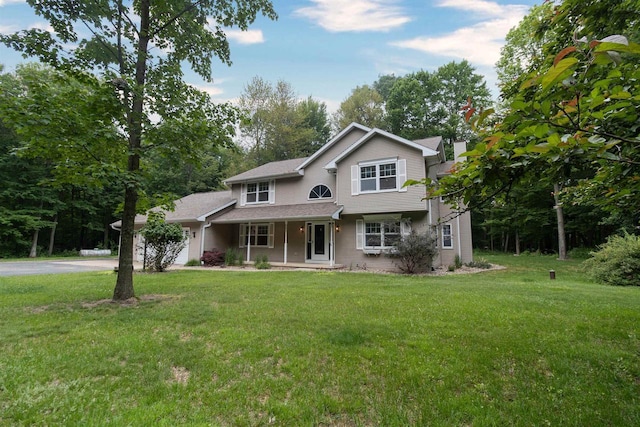 N2559 Pleasant View Ln, Waupaca, WI 54981 - traditional-style home with a porch, a front yard, and driveway