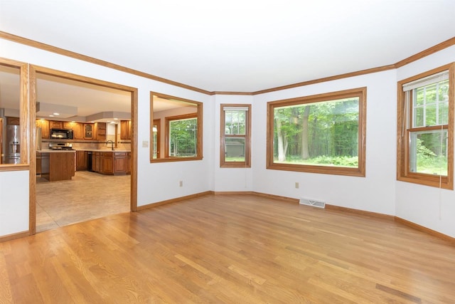 N2559 Pleasant View Ln, Waupaca, WI 54981 - unfurnished room with light wood-style flooring and ornamental molding