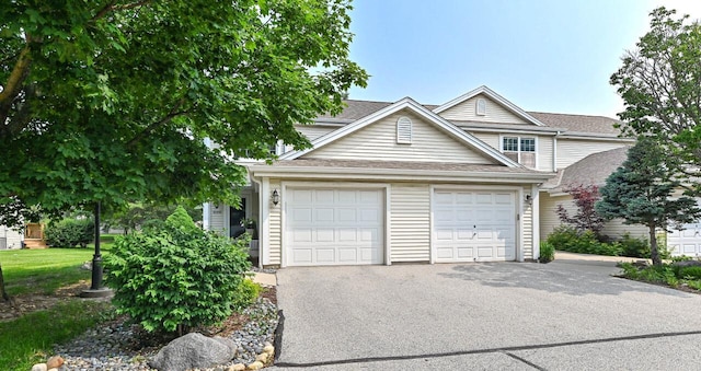 2147 E Broadway Unit A, Waukesha, WI 53186 - traditional home featuring a garage and asphalt driveway