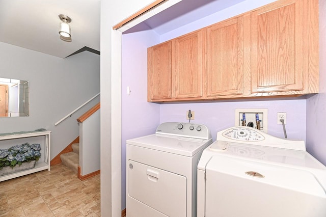 2147 E Broadway Unit A, Waukesha, WI 53186 - laundry area featuring separate washer and dryer, cabinet space, and stone finish flooring