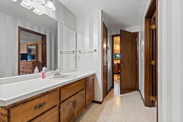 2409 Cedar Ridge Ct Unit D, Green Bay, WI 54313 - bathroom with vanity, tile patterned floors, and ensuite bath