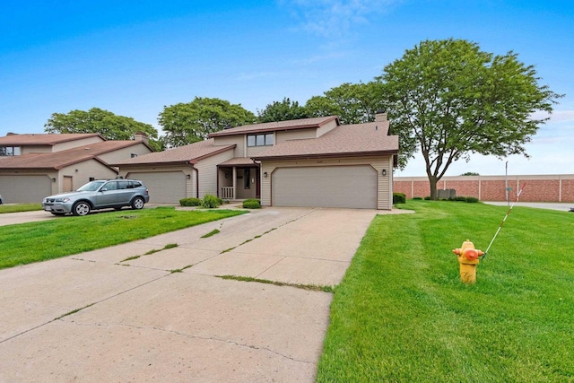2409 Cedar Ridge Ct Unit D, Green Bay, WI 54313 - view of front of property featuring an attached garage, a front yard, driveway, and a chimney