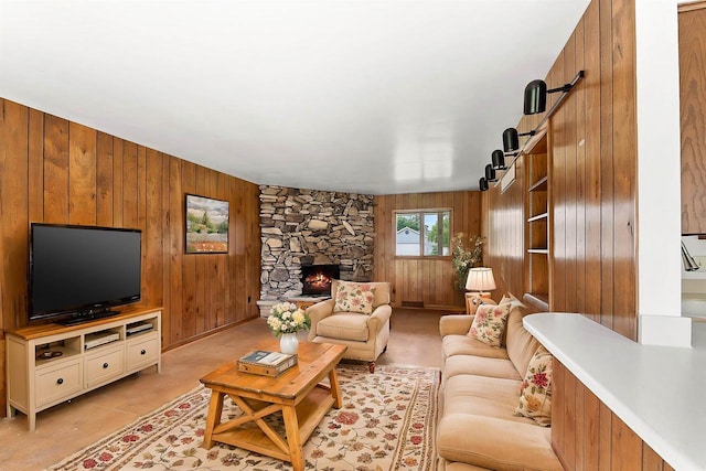 614 8th St, Fond Du Lac, WI 54935 - living area featuring wooden walls, a fireplace, and a barn door