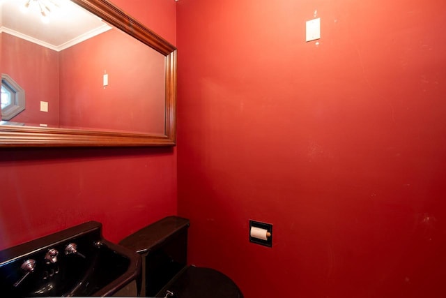 645 Wisconsin St, Oshkosh, WI 54901 - half bathroom featuring toilet and crown molding