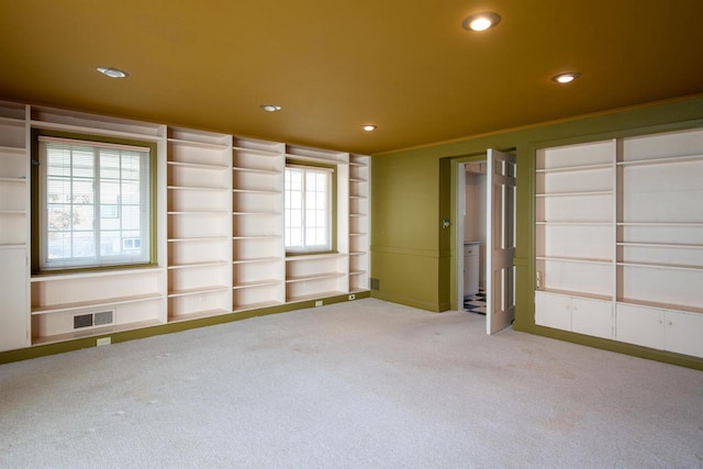 645 Wisconsin St, Oshkosh, WI 54901 - empty room with carpet floors and recessed lighting