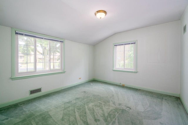 645 Wisconsin St, Oshkosh, WI 54901 - empty room featuring lofted ceiling and carpet flooring