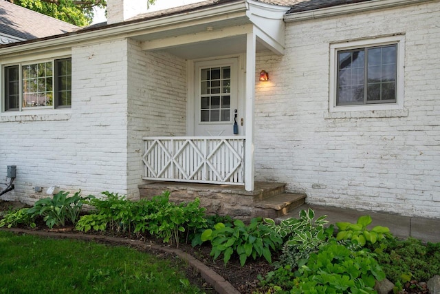 645 Wisconsin St, Oshkosh, WI 54901 - property entrance with brick siding and a chimney