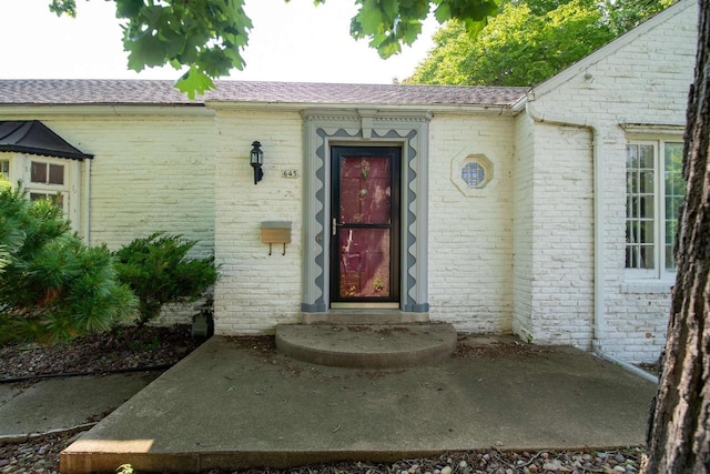 645 Wisconsin St, Oshkosh, WI 54901 - property entrance featuring brick siding