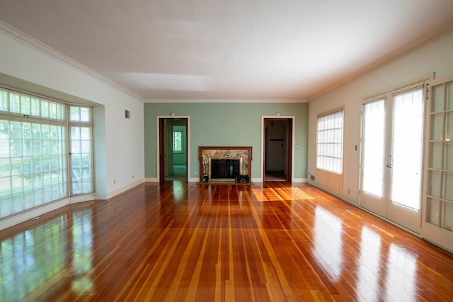 645 Wisconsin St, Oshkosh, WI 54901 - unfurnished living room featuring a fireplace with flush hearth, wood-type flooring, healthy amount of natural light, and crown molding