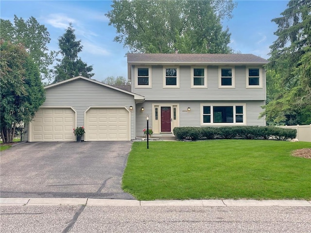 3203 Canterbury Cir, Saint Paul, MN 55125 - colonial house featuring a garage, driveway, and a front yard