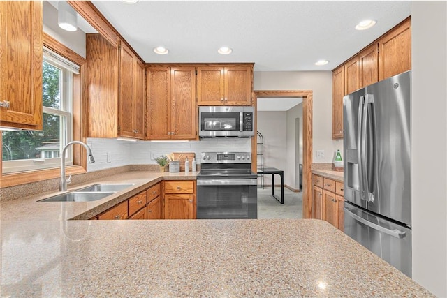 3203 Canterbury Cir, Saint Paul, MN 55125 - kitchen featuring stainless steel appliances, tasteful backsplash, brown cabinets, and recessed lighting
