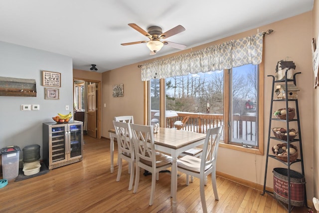 W6815 N Walworth Rd, Walworth, WI 53184 - dining room featuring wine cooler, light wood-style flooring, and ceiling fan