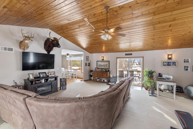 W6815 N Walworth Rd, Walworth, WI 53184 - carpeted living room with ceiling fan, wood ceiling, and lofted ceiling