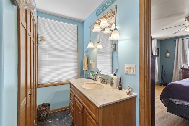 W6815 N Walworth Rd, Walworth, WI 53184 - bathroom with vanity, ceiling fan, ensuite bathroom, and wood finished floors