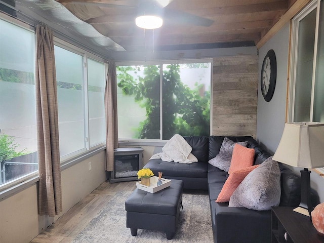 1425 Rogers St, Stevens Point, WI 54481 - sunroom / solarium featuring plenty of natural light, wood finished floors, wooden walls, and an outdoor living space