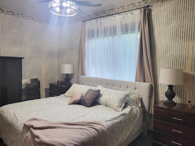 1425 Rogers St, Stevens Point, WI 54481 - bedroom with wallpapered walls and a ceiling fan