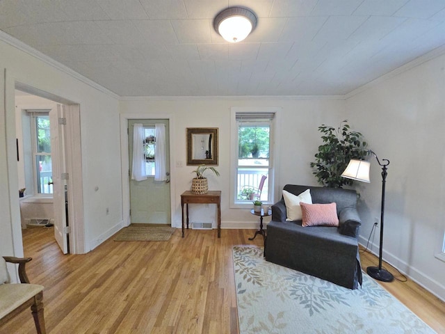 1716 Oak St, Stevens Point, WI 54481 - living area featuring light wood finished floors and crown molding