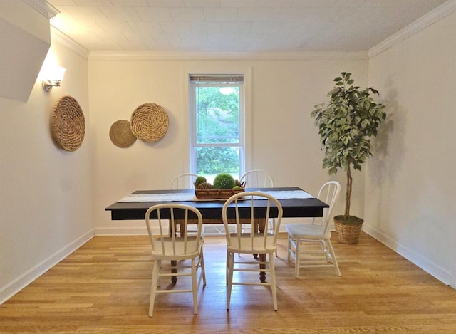 1716 Oak St, Stevens Point, WI 54481 - dining area featuring ornamental molding and light wood-style flooring