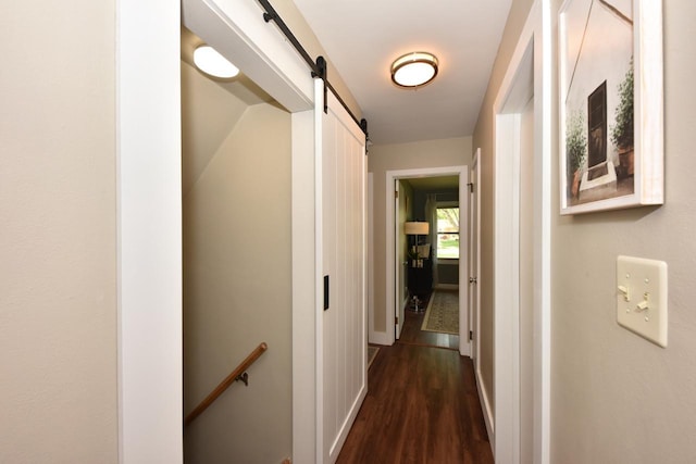 N68W15240 Prudence Dr, Menomonee Falls, WI 53051 - corridor with a barn door, dark wood-type flooring, and an upstairs landing