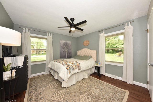 N68W15240 Prudence Dr, Menomonee Falls, WI 53051 - bedroom featuring multiple windows, wood finished floors, and ceiling fan