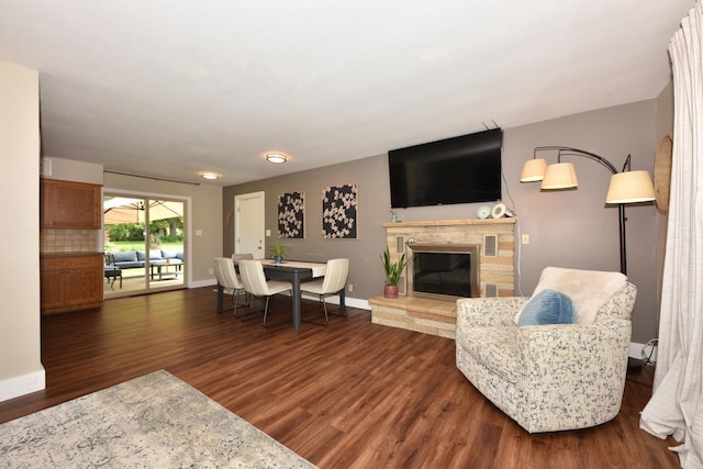 N68W15240 Prudence Dr, Menomonee Falls, WI 53051 - living room with a stone fireplace and dark wood-style floors