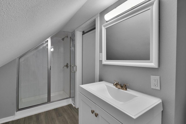 2863 N 38th St, Milwaukee, WI 53210 - full bath featuring a shower stall, vanity, wood finished floors, and a textured ceiling