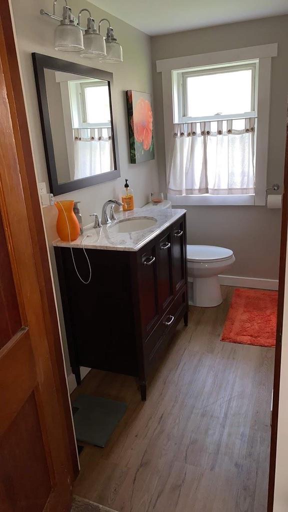 3151 Reddin Rd, Wisconsin Rapids, WI 54495 - bathroom with vanity and wood finished floors