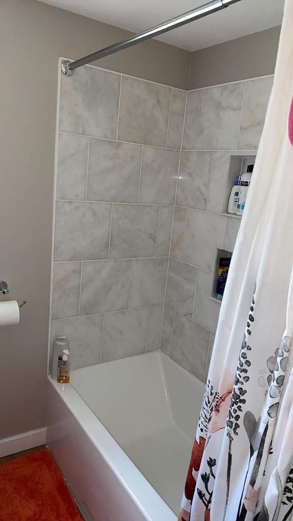 3151 Reddin Rd, Wisconsin Rapids, WI 54495 - bathroom featuring shower / bath combination with curtain and baseboards