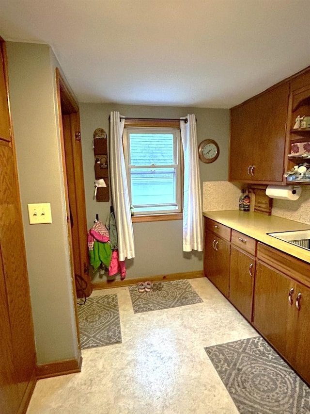 3151 Reddin Rd, Wisconsin Rapids, WI 54495 - kitchen with light countertops, brown cabinetry, and open shelves