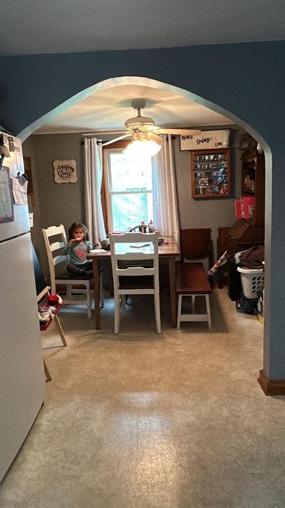 3151 Reddin Rd, Wisconsin Rapids, WI 54495 - carpeted dining area with arched walkways and ceiling fan
