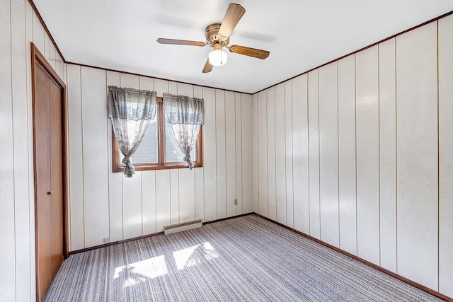 11975 E Anderson Lake Dr, Suring, WI 54174 - carpeted empty room featuring ceiling fan and a baseboard heating unit