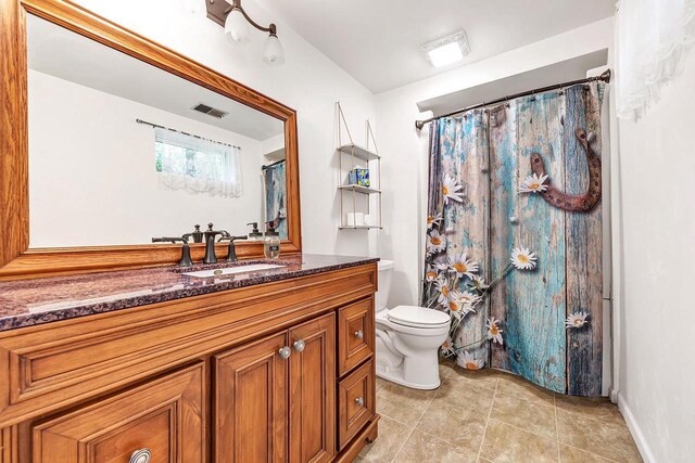 11975 E Anderson Lake Dr, Suring, WI 54174 - full bathroom with vanity, tile patterned flooring, and a shower with curtain