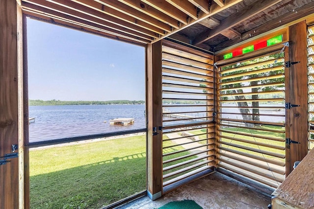 11975 E Anderson Lake Dr, Suring, WI 54174 - doorway to outside with a water view and unfinished concrete floors