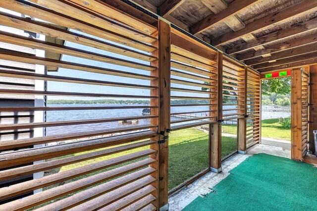 11975 E Anderson Lake Dr, Suring, WI 54174 - unfurnished sunroom featuring a water view