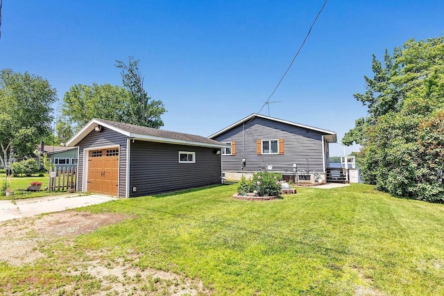 11975 E Anderson Lake Dr, Suring, WI 54174 - back of house with an outdoor structure, a yard, and a detached garage