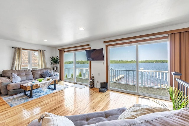 11975 E Anderson Lake Dr, Suring, WI 54174 - living area featuring hardwood / wood-style floors, healthy amount of natural light, and recessed lighting