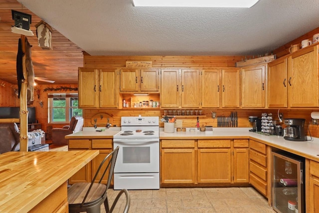 7454 State Highway 186, Arpin, WI 54410 - kitchen with electric stove, wine cooler, open shelves, and a textured ceiling