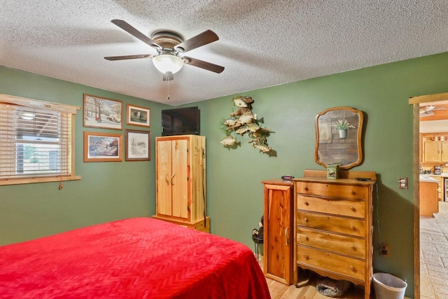 7454 State Highway 186, Arpin, WI 54410 - bedroom with a textured ceiling and a ceiling fan