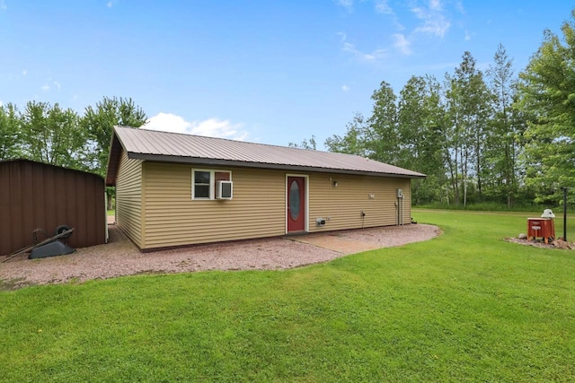 7454 State Highway 186, Arpin, WI 54410 - back of property featuring a patio, a yard, a metal roof, and a storage shed