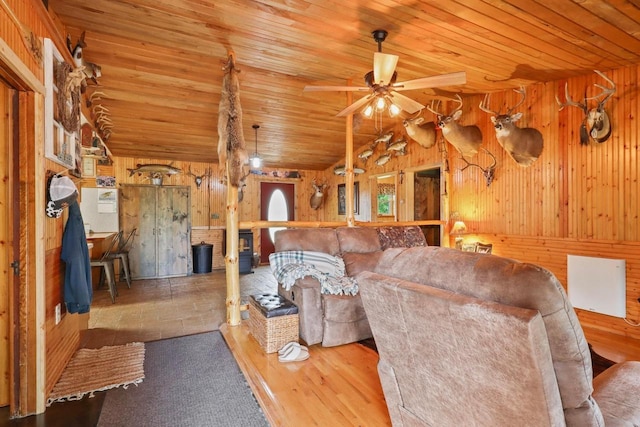 7454 State Highway 186, Arpin, WI 54410 - living room featuring wood walls, wood ceiling, a ceiling fan, and lofted ceiling