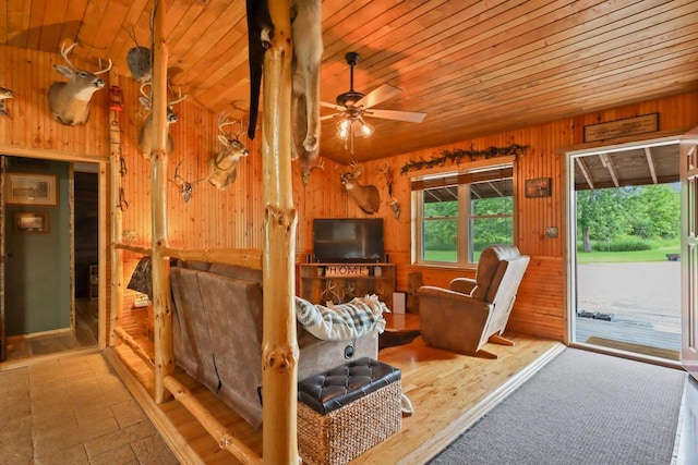 7454 State Highway 186, Arpin, WI 54410 - living room with wooden ceiling, wooden walls, and a ceiling fan