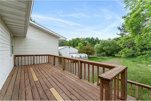 1231 135th St, Amery, WI 54005 - wooden deck with a yard and a detached garage