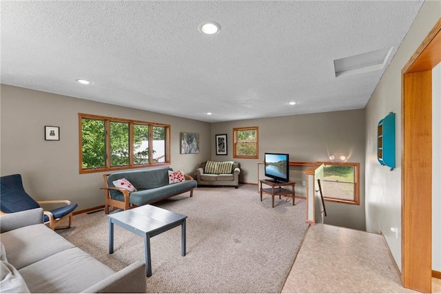 1231 135th St, Amery, WI 54005 - living room featuring a textured ceiling, attic access, and recessed lighting