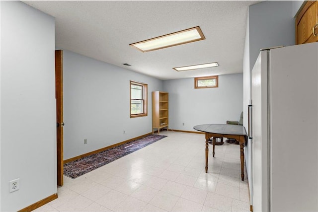 1231 135th St, Amery, WI 54005 - interior space featuring freestanding refrigerator and baseboards