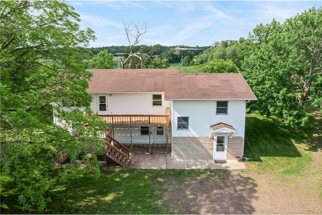 1231 135th St, Amery, WI 54005 - rear view of property with a patio, a deck, a lawn, and stairs